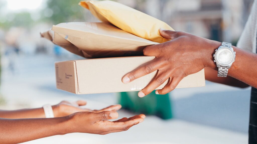 person handing over packages 1024x577 1
